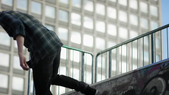 Skater jumps off a half pipe