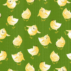 Little yellow chicken on grassy background. Vector seamless background.