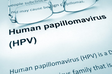 Paper with words  HPV infection and glasses.