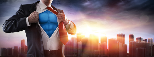 Businessman Superhero With Sunset In City
 - obrazy, fototapety, plakaty