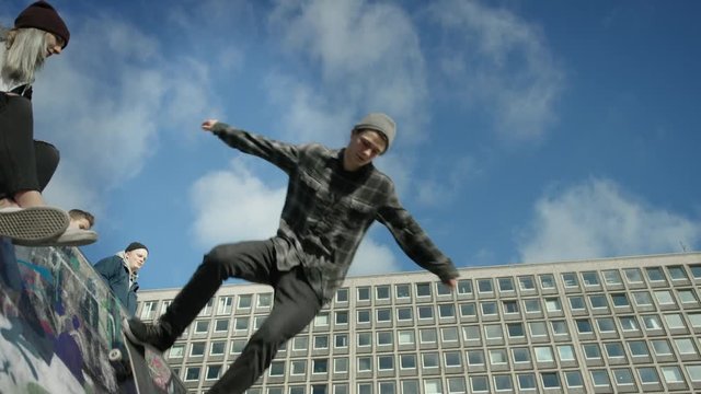 Skater and boy on bmx on halfpipe