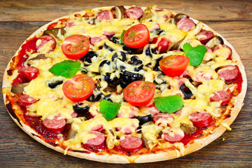 Pepperoni Pizza with Sausage, Cheese, Mozzarella, Olives and Bas