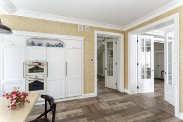 White kitchen interior and open door