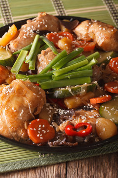 Dakjim braised chicken with vegetables in a Korean style close-up. Vertical
