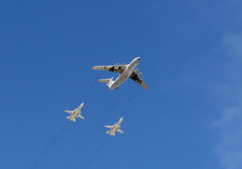 Simulation of refueling in the air from the aircraft-tanker Il-78M front-line bomber with variable sweep wing su-24 . Rehearsal of parade in honor of the 70th anniversary of Victory