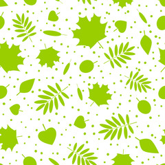 Seamless pattern with green leaves silhouettes 