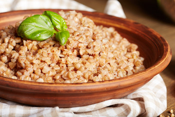 buckwheat porridge close up in a clay plate