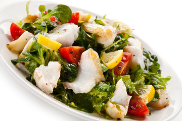 Fish salad - fried cod and vegetables 