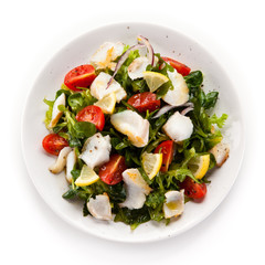 Fish salad - fried cod and vegetables 