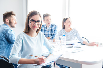  Cheerful girl making notes