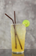 Refreshing iced lemonade served with sliced lemon piece isolated