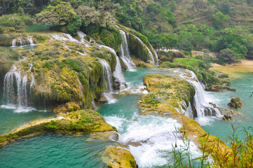 Fototapeta premium Beautiful cascade of waterfalls on a fast river