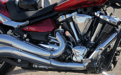 Fototapeta na wymiar the beautiful, chrome plated, mirror engine of the bike