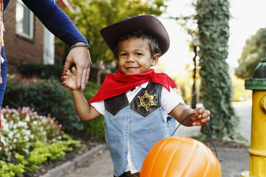 Mother with son dressed as cowboy for Halloween