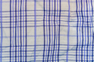background, texture of a checkered gray fabric with blue stripes