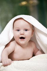 Sweet small baby with towel