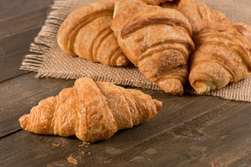 Breakfast croissant on a rustic background