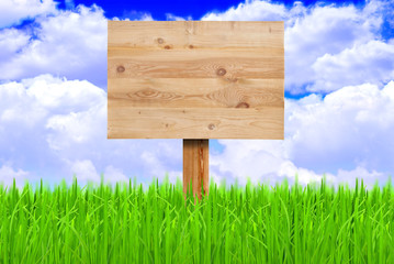 Wooden sign in a meadow