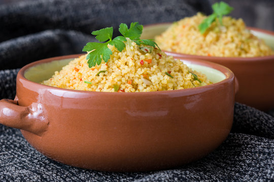 Couscous with vegetables on tablecloth
