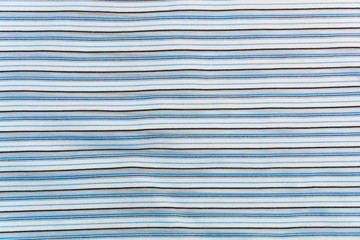 background, texture of a knitted fabric with white, gray, blue, black stripes