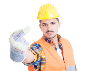 Fototapeta premium Young constructor showing obscene middle finger gesture