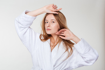 Naklejka premium Beauty portrait of a young woman in bathrobe