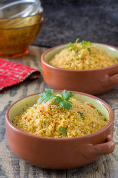 Couscous with vegetables on wood

