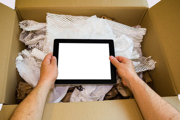 Hands unboxing new tablet computer