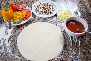 Ingredients For Making Vegetarian Pizza On Marble Table Top View