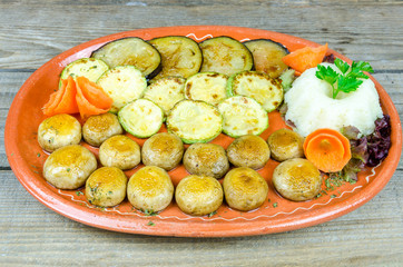 Grilled vegetables on a clay plate