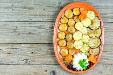 Grilled vegetables on a clay plate