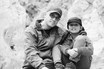 Portrait of father and son outdoors