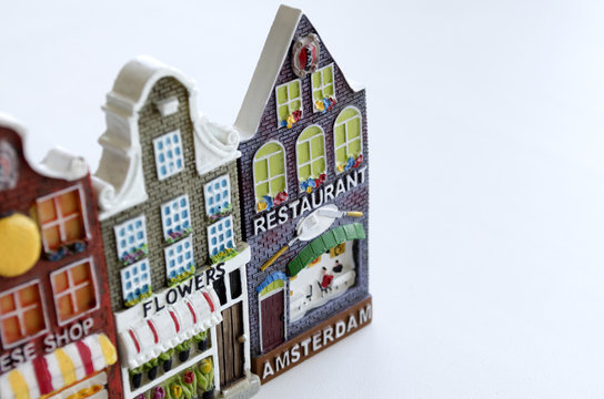 souvenirs from Holland in form of houses facades on a light background
