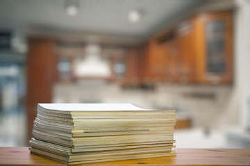stack of old magazines on wooden table