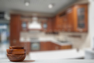 stack of empty wooden bowls on table