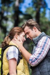 Couple touching head while hiking 