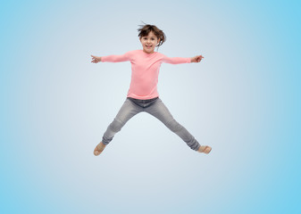 happy little girl jumping in air