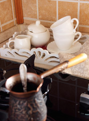 Brewed coffee Cezve and cup with sugar..