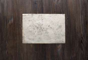 paper on wooden background