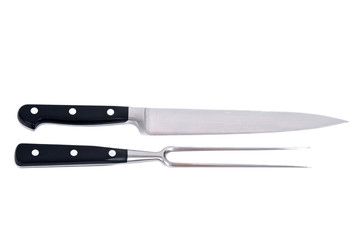 Carving knife and fork separated on white background