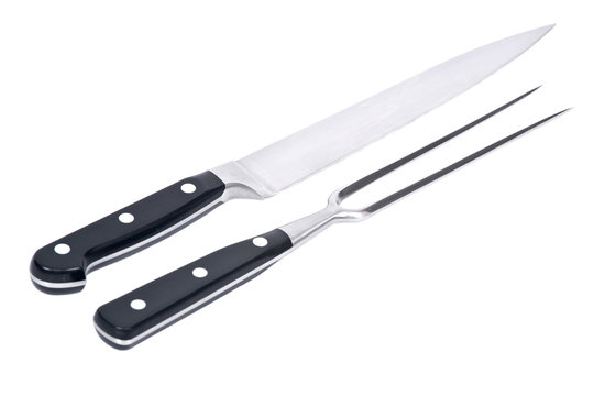 Carving knife and fork separated on white background