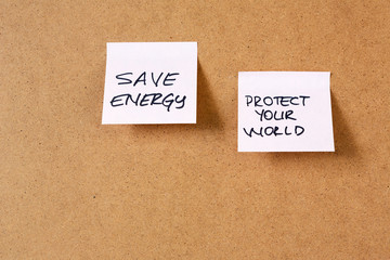 sticky note on cork  board, hand writing notes