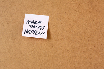 sticky note on cork  board, hand writing notes