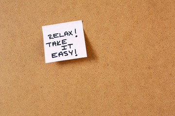 sticky note on cork  board, hand writing notes