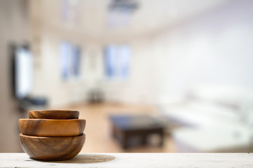 stack of empty wooden bowls on table