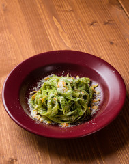 tagliatelle dish in red plate