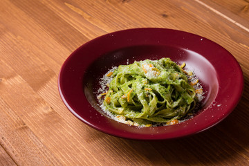 tagliatelle dish in red plate
