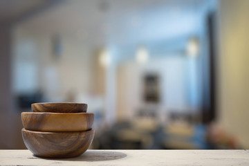 stack of empty wooden bowls on table