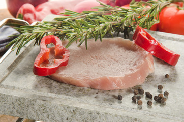 boneless raw pork chop with paprika and rosemary