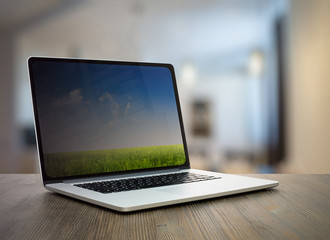 Fototapeta premium computer on wooden table in room